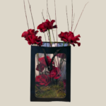 Black gift bag arrangement with red roses, wild branches, and moss — luxury Valentine’s bouquet for Lebanon delivery.