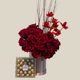 Luxurious pink flower box with red roses, open tulips, and Ferrero Rocher chocolates – Valentine’s gift delivery in Lebanon.