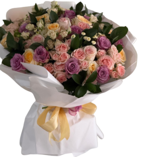 Pastel roses Mother’s Day bouquet in Lebanon with pink purple and peach flowers wrapped in elegant white paper.