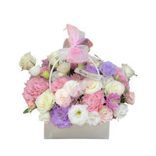 Elegant pastel Mother’s Day flower basket with pink, white and lilac blooms by Terraflora Lebanon.